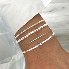 Beautiful bracelet set with carefully selected bracelets with gold, silver or rose gold. The perfect gift, suitable for most wrist sizes.• Size: adjustable in length from 16-19 cm. The model in the photo has a wrist size of 15.5 cm• 14kt (Rose) Gold plated / 925 Silver plated base, nickel free and lead free• Handmade in the Netherlands• Official Mint15 label• Copyrighted design by Mint15 © Beaded Bracelet Sets, Ideas For Bracelets With Beads, Silver Beaded Bracelets, Timeless Bracelet, Bracelet Sets, White Bracelet, Diy Bracelet Designs, Beads Bracelet Design, Diamond Jewelry Designs