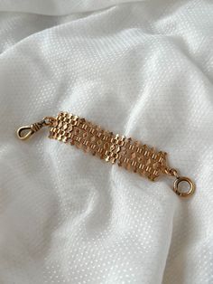 A fascinating Victorian 10ct pink gold watch fob containing both a dog clip and C clasp. What’s specifically intriguing about it are the rows of 32 miniature arrows, pointing outward from the central rhombus of the symmetrical geometric design. It has a delightful heft to it, and beautiful simple cast details which bring the piece to life. It would would have been worn as a piece of ornamentation across the exterior of a vest or jacket in true masculine peacocking jewel form. Materials and Featu Formal Link Bracelet Strap Jewelry, Formal Link Bracelet With Strap, Formal Link Bracelet Jewelry, Formal Bracelet Jewelry With Hooks And Links, Timeless Link Bracelet Jewelry, Timeless Formal Bracelets With Spring Ring Clasp, Timeless Formal Bracelet With Spring Ring Clasp, Timeless Bracelet With Spring Ring Clasp For Formal Events, Rose Gold Rectangular Jewelry With Bracelet Strap