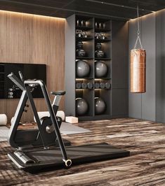 an exercise room is shown with a treadmill and boxing punching bag in the background