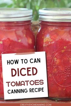 two jars filled with diced tomatoes sitting on top of a table next to a sign that says how to can diced tomatoes canning recipe