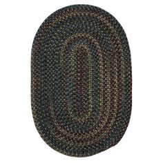 the oval rug is made from multicolored yarn