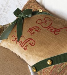 a decorative pillow with the word sale on it and a green ribbon tied around it