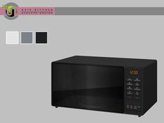 a black microwave oven sitting on top of a gray table next to different color swatches