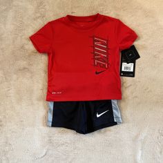 Nike Baby Boys Outfit Size 12 Months. Short Sleeve Shirt And Shorts. Red Shirt And Black Shorts. Brand New! Nike Short Sleeve Sports Sets, Nike Sports Sets With Short Sleeve, Nike Sports Set With Short Sleeves, Nike Sporty Short Sleeve Sets, Sporty Red Shorts For Playwear, Red Sporty Playwear Sets, Sporty Red Playwear Set, Red Cotton Sports Set, Nike Red Playwear Sets