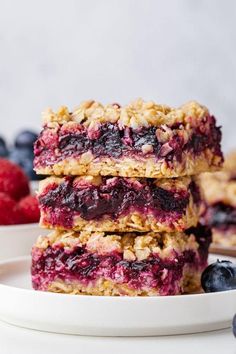 a stack of blueberry crumb bars sitting on top of a table