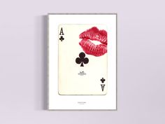 a playing card with red lipstick on it