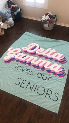 a sign on the floor that says, delta gaming loves our senior's t - shirts