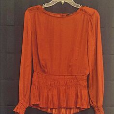 I Never Got To Wear This Lovely Top As It Was Too Small. It Has Its Original Tahari Tag On It . The Actual Color Is More Of A Rust/ Nutmeg Color. It Looks Orange In The Pic. It Is 100% Polyester, But Feels Like Silk Against The Body. It Has One Button On The Back Which Is Covered In The Same Beautiful Material. So Feminine! Elegant Orange Blouse For Fall, Fitted Orange Tops For Work, Elegant Orange Top For Fall, Elegant Orange Tops For Fall, Chic Orange Long Sleeve Blouse, Fitted Orange Blouse For Work, Chic Fitted Orange Blouse, Chic Orange Fitted Blouse, Chic Orange Tops For Workwear