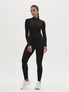 Why We Love It: The Hannah Long Sleeve Zipper Bodysuit is the epitome of sleek, modern activewear. This bodysuit combines functionality with a streamlined design, ensuring you look and feel your best whether you're at the gym or out and about. Fit and Features: Front Zipper Detail: The front zipper allows for easy wear and adjustability, adding a chic element to this versatile piece. Long Sleeves with Thumbholes: Provides added coverage and a secure fit, perfect for cooler weather or intense workouts. Buttery Soft Fabric: This bodysuit feels like a second skin, offering unmatched comfort and flexibility. High Performance: The four-way stretch material ensures maximum freedom of movement, making it ideal for any activity. Moisture-Wicking Technology: Keeps you dry and comfortable, no matter Fitted Sporty Bodysuit For Loungewear, Sporty Fitted Bodysuit For Loungewear, Fitted Workout Bodysuit With Thumbholes, Compressive Unitard With Thumbholes, Compressive Solid Unitard With Thumbholes, Functional Second-skin Activewear For Gym, Second-skin Functional Activewear For Gym, Functional Second-skin Yoga Activewear, High Stretch Full Length Bodysuit With Thumbholes