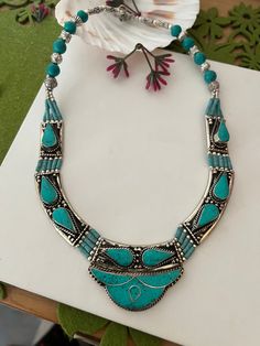 Complement your personality with this trendy unique design.  The gorgeous necklace is beautifully handcrafted by our skilled Indian craftsmen in stones and beads. Material: German Silver.  Turquoise Stones  The length of the necklace when falls on the body is approximately 9 inches  Hook closure The weight of the necklace is 125 grams Turquoise Stones, German Silver, Gorgeous Necklaces, Silver Turquoise, Himalayan, Turquoise Stone, Necklace Etsy, Unique Design, Etsy Accessories