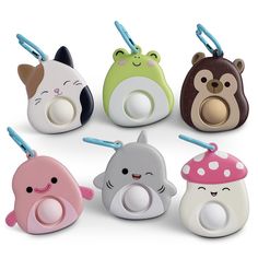 several different shaped toothbrush holders with cartoon animals on them, all in various colors and shapes