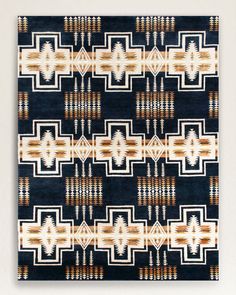 a blue and white area rug with an abstract design