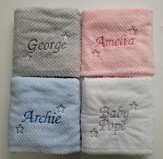 four personalized towels are laid out on top of each other