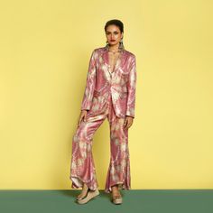 Add some sequins to your festive and party events this season with Katyani Pant Suit set. The flattering sequin wide leg pants are high waisted and complements every body type. The pant suit is trans seasonal . The front hook full sequin blazer has pockets. The model is wearing size S. 🌸 〰️〰️〰️ 🌸 〰️〰️〰️ 🌸 Care and Composition100% Sequin.Dry clean/Hand wash in cold water. Mild liquid detergent only. Do not soak or wring. Designed & Made in India. Chic Festive Evening Pant Set, Chic Evening Festive Pant Set, Sequined Palazzo Set For Eid Evening, Summer Glamorous Formal Sets, Chic Festive Eid Sets, Glamorous Formal Summer Sets, Chic Party Sets For Eid, Chic Festive Sets With Straight Pants, Summer Wide-leg Pantsuit For Party