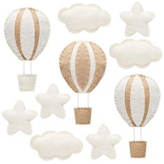 an assortment of hot air balloons in the shape of stars and clouds on a white background