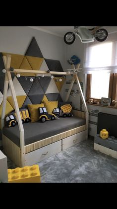 a child's bedroom decorated in yellow and gray