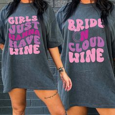 "The Bride on Cloud Wine Shirts are perfect for a delightful winery bachelorette celebration. These shirts playfully capture the spirit of the event with a clever play on words, celebrating the bride's love for wine. Made for comfort and style, these shirts will keep the bride and her wine-loving crew in high spirits as they tour vineyards, taste fine wines, and create memorable moments during the winery bachelorette. 💙How To Order?🧡 𝟏. Choose your shirt Size, 𝟐. Choose your shirt Color, 𝟑. Select the quantity, 𝟒. Click Add To Court. For multiple items go back to the listing and repeat the steps. If you have any difficulties, send us a message or click on the \"Request A Custom Order\" button and we'll create a private listing for you. 💙 Custom Design 🧡 Are you looking for a custom Graphic Print Short Sleeve Top For Hen Party, Hen Party Graphic Print Short Sleeve Top, Pink Hen Party Top With Graphic Print, Graphic Print Crew Neck Top For Hen Party, Party T-shirt With Funny Print, Cloud Wine Bachelorette, Bach Weekend Tshirts Wine, Wine Themed Bachelorette Party Shirts, Winery Bachelorette Party Shirts