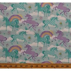 the fabric is very colorful and has unicorns on it