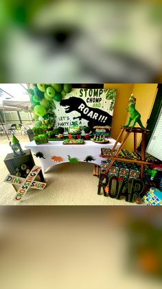 the table is set up with green decorations