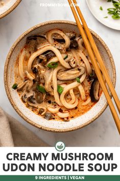 creamy mushroom udon noodle soup in a bowl with chopsticks on the side