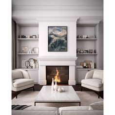 a living room filled with furniture and a fire place in front of a painting on the wall