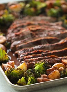 broccoli, potatoes and meat are in a pan