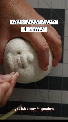 someone is holding something in their hand with the words how to sculpt a smile on it