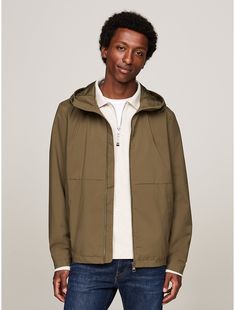 Tommy Hilfiger men's jacket. When the weather won't quit, this do-it-all jacket is water resistant, wind proof, and totally durable. With a bungee drawcord hood, a semi-elastic hem, and subtle touches of branding, we consider it a year-round staple.  Material: 63% Recycled Polyester (rpe), 37% Thermoplastic Polyurethane. Tommy Hilfiger Fall Outdoor Outerwear, Functional Khaki Windbreaker With Drawstring Hood, Casual Hooded Tommy Hilfiger Windbreaker, Tommy Hilfiger Casual Hooded Windbreaker, Tommy Hilfiger Windbreaker For Outdoor Fall Activities, Tommy Hilfiger Windbreaker For Fall Outdoor Activities, Tommy Hilfiger Windbreaker For Fall Outdoor, Tommy Hilfiger Casual Outdoor Windbreaker, Tommy Hilfiger Spring Outdoor Outerwear