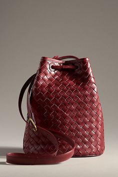 Leather; cotton lining One inner slip pocket Drawstring closure Imported | Adele Bucket Bag by Bembien in Red, Women's, Cotton/Leather at Anthropologie Elegant Red Shoulder Bag With Intrecciato Weave, Elegant Red Woven Leather Bag, Red Woven Leather Shoulder Bag For Travel, Red Intrecciato Weave Tote Bag, Red Tote Bag With Intrecciato Weave, Red Intrecciato Weave Shoulder Bag, Red Intrecciato Weave Shoulder Bag For Daily Use, Chic Red Bag With Intrecciato Weave, Chic Red Bags With Intrecciato Weave