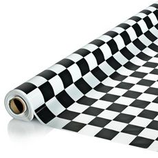 a black and white checkerboard pattern on a roll of wrapping paper that is rolled up