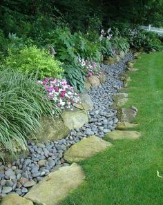 a garden filled with lots of rocks and flowers