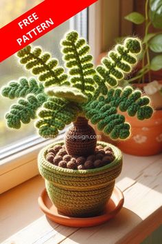 a crocheted potted plant sitting on top of a window sill