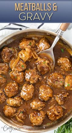 meatballs and gravy in a skillet with a spoon