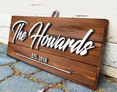 a wooden sign that says the howards on it