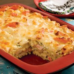 a casserole with meat and cheese in a red dish