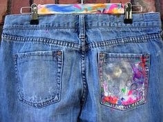 a pair of jeans with colorful patches on them