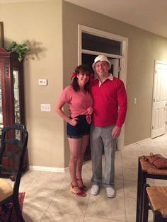 a man and woman standing in a living room