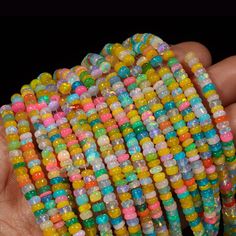 AAA+ Ethiopian Opal Disco Smooth Rondelle Bead Welo Opal Bead Multi Color Opal Cut Rondelle beads Opal Plain Beads Fire Opal Beads Stone: Opal Shape: Rondelle  Style: Faceted Beads Size: 3-5.5 mm approx Quality: AAA+ Grade High Quality If You Wants More Pictures Of Products Please Feel Free For Any Queries And Send Us Your Whatsapp Number That Will Help Us To Send You More Pictures And Every Detail Of Product. These Are Natural Gemstones Therefore, Variation In The Shade & Quality Is Expected. Gemstone Picture Shown Are Of Actual Gemstone That You Will Receive, However, The Color & Appearance May Look Slightly Different Depending On Your Monitor Resolution & Climatic Condition. Some Imperfections Can Be Expected As Stones Are Natural. If Required, Please Ask Us To Show The Lot Image Before Multicolor Faceted Round Beads, Faceted Oval Beads Necklace For Beach, Multicolor Polished Round Beads Bracelet, Multicolor Polished Beads Bracelet, Multicolor Heart Beads Round Beaded Bracelets, Multicolor Polished Beads Bracelet For Beach, Multicolor Polished Beads Bracelets For Beach, Beach-ready Polished Multicolor Beaded Bracelets, Yellow Faceted Beads Necklace For Beach