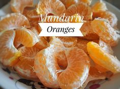 mandarin oranges on a plate with the words mandarin oranges overlaying them