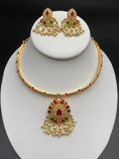 Unique style kante with navarathna Stones pendant and matching earrings Handmade jewelry One gram gold jewelry Silver plated jewelry Official Website globusfashions.com 🌸 S H O P . M O R E . S T Y L E S 🌸 https://www.etsy.com/shop/Globusfashions Necklaces - https://www.etsy.com/shop/Globusfashions?section_id=18712263 Bracelets - https://www.etsy.com/shop/Globusfashions?section_id=18969767 Pendant Sets - https://www.etsy.com/shop/Globusfashions?section_id=18707402 Tikka - https://www.etsy.com/s Jumka Earrings, Necklace Set Gold, Stone Necklace Set, Stones Necklace, Chandbali Earrings, Satin Bags, Wear Necklaces, Wire Necklace, Gold Necklace Set