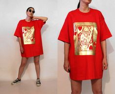 "vintage '90s red queen of hearts t-shirt or dress large metallic gold queen of hearts playing card on front oversized - longer length DETAILS-----> Era: '90s Fabric:  cotton MEASUREMENTS-----> Tag: marked a size XXL - should suit a size large - xxl Shoulders: n/a Bust:  25.5\" Waist: n/a Length:  32\" CONDITION-----> In excellent vintage condition. No flaws to note.  Appears unworn. *Model is xs/s / 5'5\" / 34\", 26\", 36\"" Red Queen Of Hearts, Hearts Playing Cards, Long Tee, Vintage Suits, Black Chevron, Scarf Dress, Red Queen, Faded Denim, Oversized Style