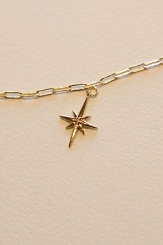 14k Gold filled North Star Charm to guide your way. This charm adds a bit of shine and fun shape to every necklace. Hand make your custom charm necklace in Laguna Beach or build your piece online through adding a base necklace and your selection of charms. Leave us a note on your order for any special requests. 14K gold filled Tarnish resistant 2.5 cm tall Celestial Yellow Gold Charms As Gifts, Celestial Yellow Gold Charm Necklaces With Star Charm, Celestial Yellow Gold Charm Necklace With Star Charm, Celestial Jewelry With Starburst Star Charm, Celestial Yellow Gold Necklace With Star Charm, Yellow Gold Star Charm Pendant Necklace, 14k Gold-filled Star Charm Jewelry, Gold Star-shaped Jewelry With Star Charm, 14k Gold-filled Yellow Gold Star Charm Jewelry