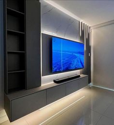 a large flat screen tv mounted to the side of a wall in a living room