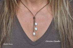 This is a 3 Pearl Lariat made with Large 14-15mm White Freshwater Rice Pearls on any color of 2mm Leather that you choose.  The neck part is 18 inches and the Lariat part with the pearls hangs another 2.5 inches. The clasp is a magnetic stainless steel with a safety turn.  *  If you want the neck part another size please comment when ordering. *  There are many options for matching earrings.  Here is the link to those in the photos. https://www.etsy.com/listing/1583993833/leather-and-pearl-rice-pearl-earrings? ** A great start or addition to your Pearl and Leather Jewelry Collection.  The Pearl and Leather Necklace in the photos has sold, but represents what you will receive. Rice Pearl Earrings, Pearl Lariat, Rice Pearls, Necklace Leather, Leather Necklace, Leather Jewelry, White Pearl, Matching Earrings, Pearl White