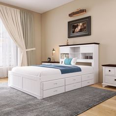 a bed room with a neatly made bed next to a window and a rug on the floor