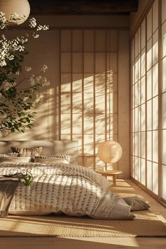 a bed sitting in a bedroom next to a window covered in white sheets and pillows