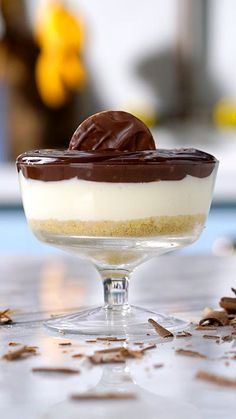 a dessert in a glass dish with chocolate on top