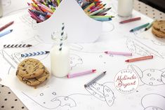 cookies and crayons are sitting on a table