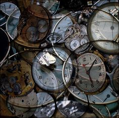 many different types of clocks are stacked on top of each other in the same pattern