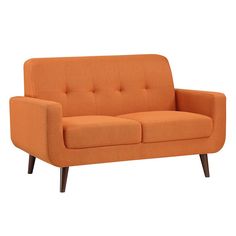 an orange couch sitting on top of a white floor next to a wooden leg chair